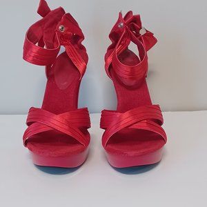 Women' red platform high heels.  Like new. Worn inside only.